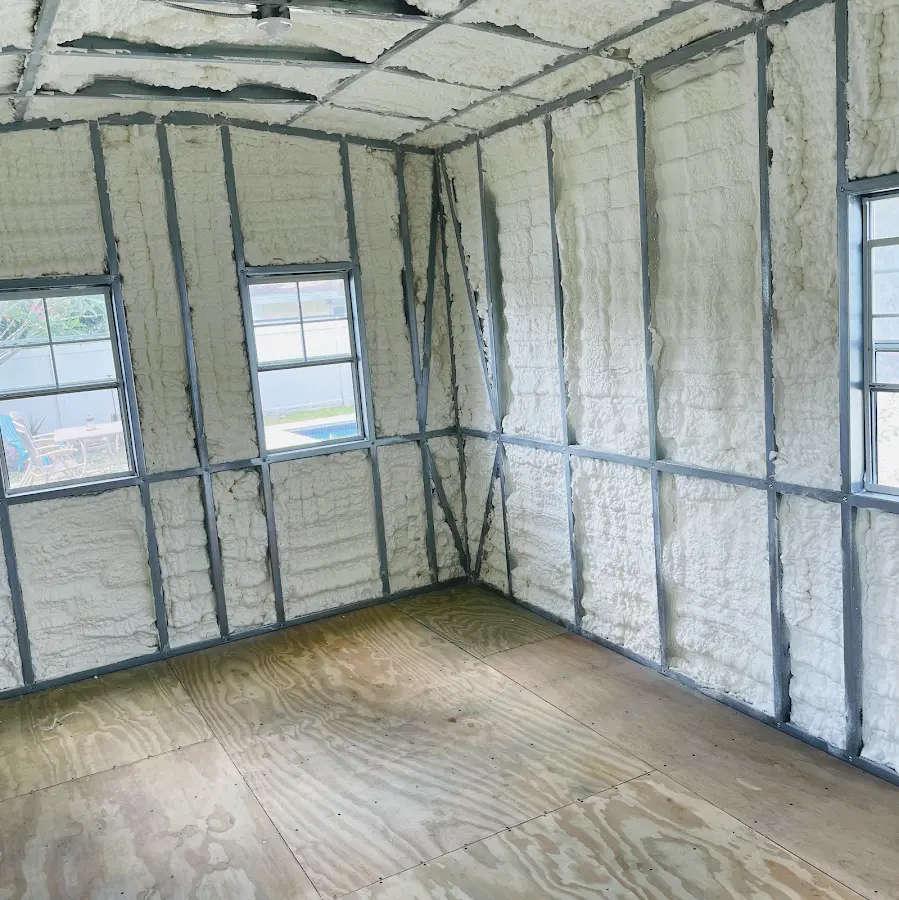 Closed-cell spray foam insulation applied to wall cavities in a residential project in Shawnee